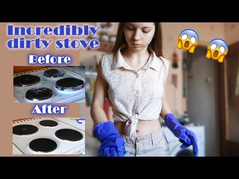 Stove cleaning with rubber gloves