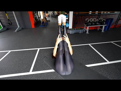yoga in the gym in a shiny spandex jumpsuit
