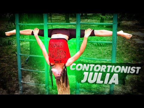 Contortionist Julia. Training for flexibility on the sport ground. Flexshow. Contortion routines.